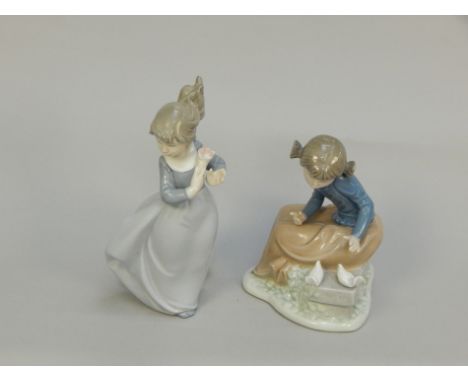 Two Nao porcelain figures, to include a lady with doves.