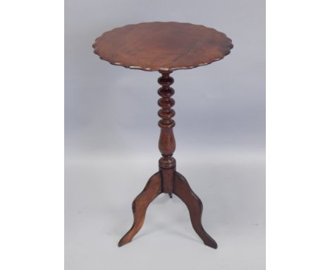 A 19thC mahogany occasional table, with a shaped top, turned column, and tripod base, 43cm diameter.