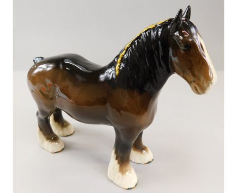 A Beswick figure of a Shire horse, gloss, 22cm high, with white hooves and painted red and green sides, black Beswick stamp t