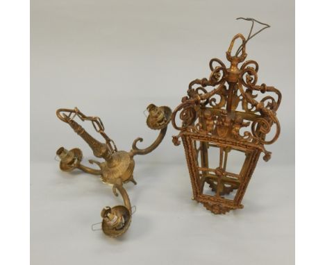 A Continental gilt metal ceiling lantern, modelled with putti, crests, etc, lacking glass, (AF), 37cm high, and another light