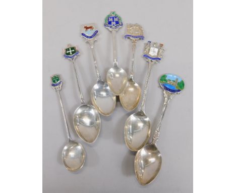 A collection of silver and enamel souvenir spoons, to include City of Oxford, Exeter Cathedral, Fountains Abbey