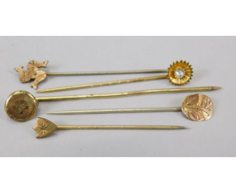 Five stick pins, Isle of Man pin, three floral and a shield, gold plated. 