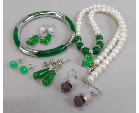 A collection of modern jade, to include a bangle, necklace and earrings.