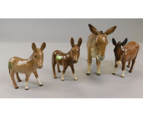 Four Beswick donkey figures, to include model number 1364B, 11.9cm high, two  donkey foals, model number 2110 and a large don