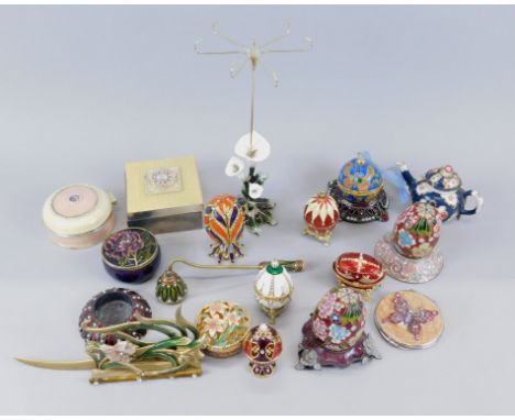 A large quantity of modern enamel style metal trinket boxes, some egg shaped boxes etc.