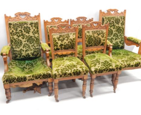 An Edwardian ash salon suite, comprising two open armchairs and four side chairs, each with turned legs and ceramic castors. 