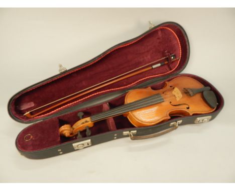 A child's violin, bearing label and bearing date 1974, with one piece back and a bow, length of back 31.5cm