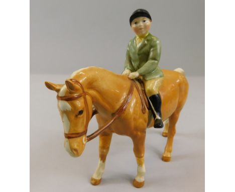 A Beswick model of a boy on a pony, model number 1500, brown, gloss, 14cm high, with black Beswick stamp to underside