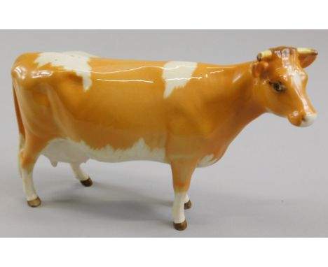 A Beswick Guernsey cow, gloss model number 1248A, 10.8cm high (boxed)