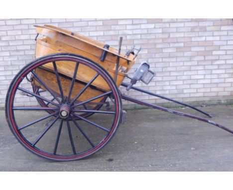 A late 19thC / early 20thC governess's  cart, the spoked wheels with brass caps for Taylor, Bakewell and a lamp, etc.