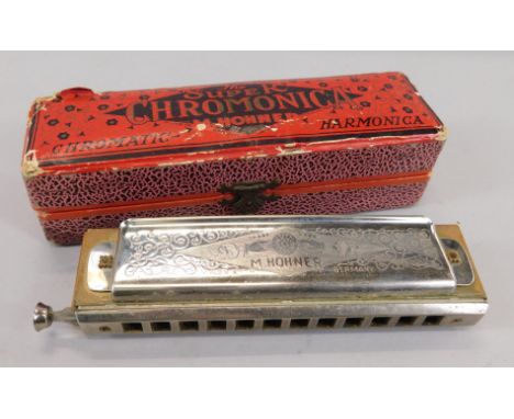 A Hohner Super Chromonica harmonica, in original box