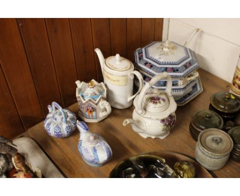 An Edwardian transfer printed soup tureen and ladle together with various teapots 
