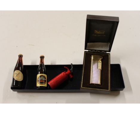 A boxed lighter; two miniature Guinness bottles etc. 