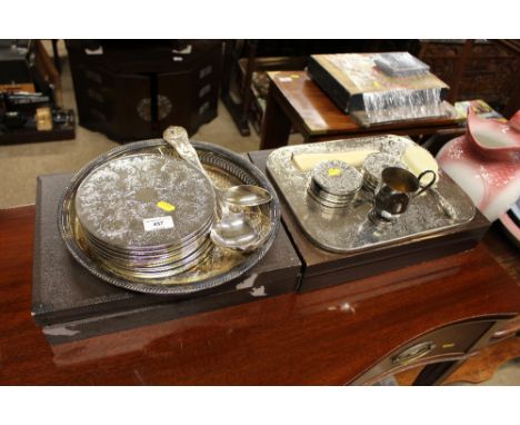 Two canteens of cutlery; various place mats; silver plated ladle and serving spoon etc. 