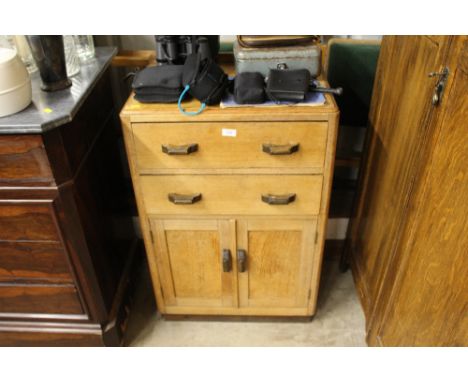 A light oak two drawer side cupboard 