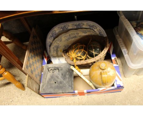 A box containing two blue and white transfer printed meat plates, two glass floats, a metal lantern a stoneware flagon etc. 
