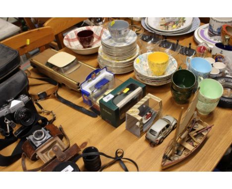 A quantity of various model cars and a small boat