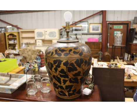 A floral decorated lamp base