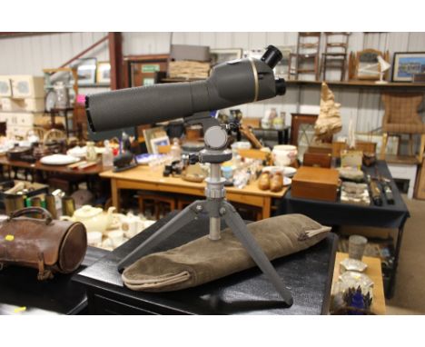 A spotting scope on tripod stand 