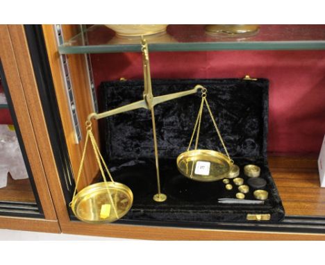 A set of brass scales and weights 