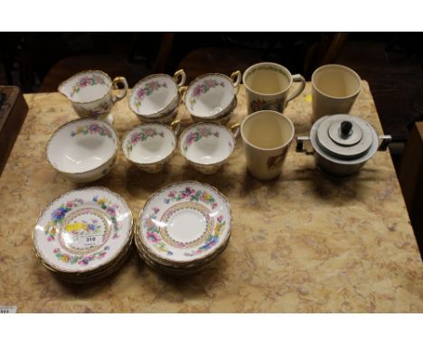 A quantity of Crown Staffordshire floral decorated teaware; a commemorative mug and two beakers; and an Art Deco twin handled