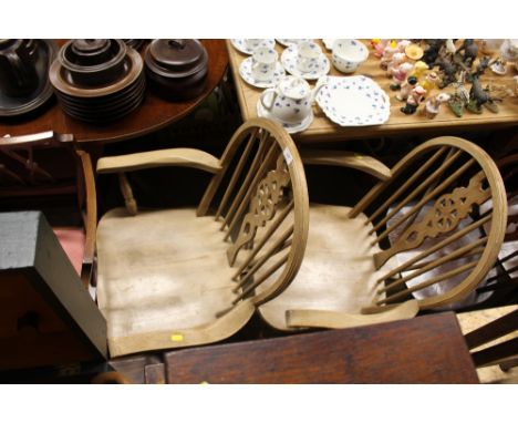 A pair of stick and wheel back carver chairs