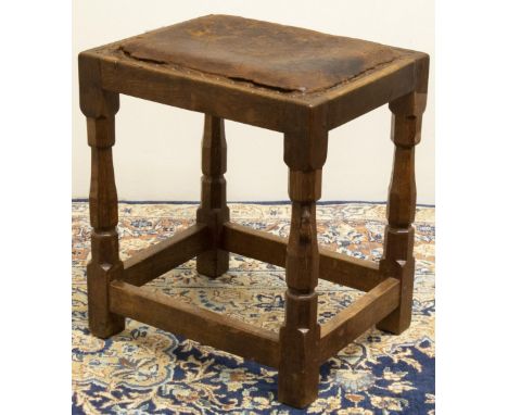 Robert "Mouseman" Thompson of Kilburn - oak rectangular stool, brass nail leather upholstered top on faceted octagonal suppor