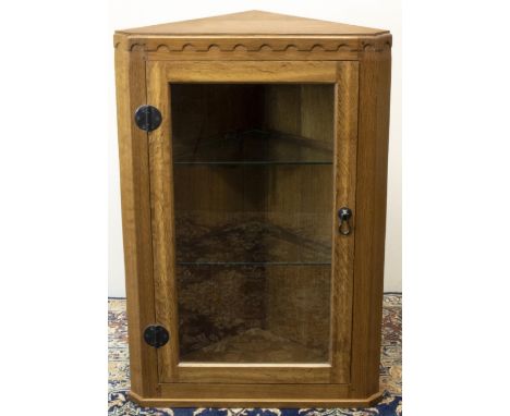 Brian Haw (former Mouseman carver) Yorkshire Oak - a corner cabinet with penny carved frieze, glazed door with wrought metal 