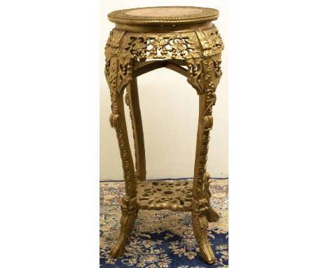 Early C20th Chinese jardiniere pedestal, circular top with inset varigated marble panel, leaf and fruit carved frieze on angu