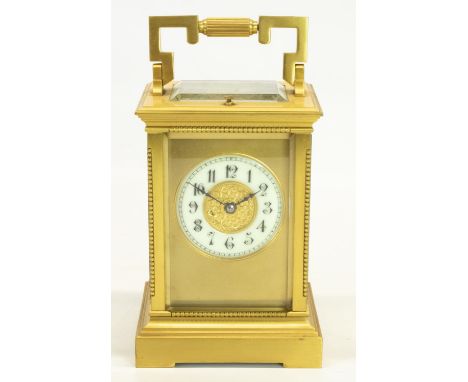 C19th French brass cased Carriage clock, bevelled glass panels with beaded column detail, white Roman dial with Gothic centre