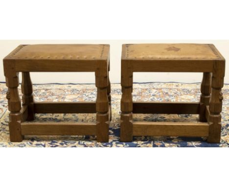 Robert "Mouseman" Thompson of Kilburn - a pair of rectangular stools, brass nailed upholstered leather tops on octagonal balu