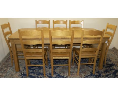 Stewart Linford Furniture - an oak dining table, rectangular extending top on square supports with two additional leaves, L20