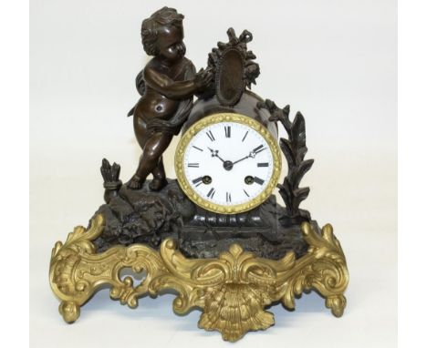 C20th French patinated and gilt spelter Figural mantel clock set with artist cherub, circular white enamel Roman dial with tw