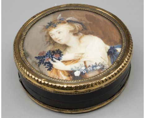 Early C19th tortoiseshell circular trinket box with gilt metal mount, set with portrait miniature of a young woman with baske
