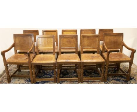 Robert "Mouseman" Thompson of Kilburn - set of ten (8 + 2) oak dining chairs, with adzed panel backs, and brass nail leather 