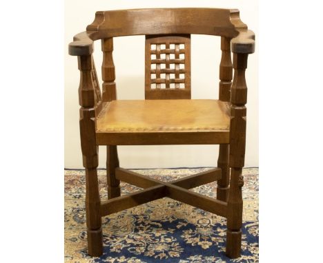 Robert "Mouseman" Thompson of Kilburn - an oak Monks chair,  curved top rail with three lattice splats and brass nailed leath