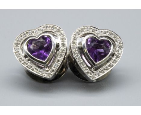 Pair of 18ct white gold amethyst and diamond heart shaped stud earrings by Theo Fennell, stamped 18k, 7.7g 