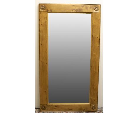 Stewart Linford Furniture - an oak wall mirror, rectangular bevelled plate in burr frame with rose carved corner detail W137c