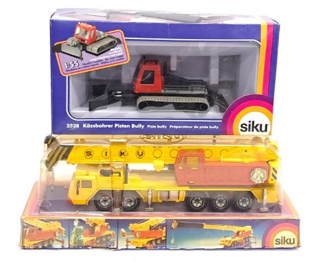 Siku, 4010 Hydraulic Crane Truck &amp; 2528 Piste Bully, a boxed pair. &nbsp;Although unchecked for completeness condition ge