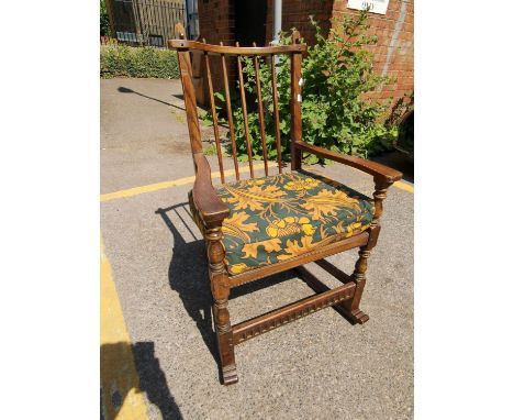 A 20th century oak stick back rocking chairLocation: 