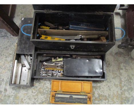 A selection of tools in ebonized wooden boxes to include a ratchet set 