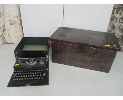 An Arts and Crafts copper clad coal box with patinated copper and hammered wrought iron strapwork and lock 27cm x 61cm x 34cm