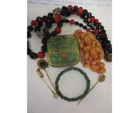 A small lot comprising a green glass bracelet in the style of Jade, and two yellow coloured hat/stick pins, and other items L