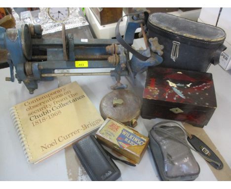 A vintage Homcan table top home canning machine in blue, and other vintage household items to include cameras Location: A1 