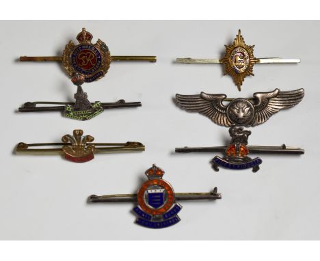 Seven pin back / sweetheart brooches including Yorkshire Regiment and Royal Army Ordnance Corps both stamped silver, the Welc