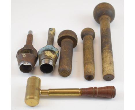 A collection of 10 bore re-loading tools comprising three wooden wad punches, two wad cutters and a powder measure.&nbsp;
