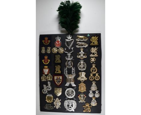 Mounted display of approximately 45 British Army anodised and cloth badges including Queen's Own Yeomanry, Wessex, Royal Lanc