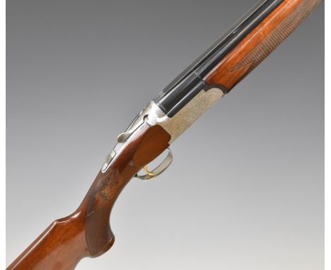 Browning Medalist 12 bore over and under ejector shotgun with named and ornately engraved lock, underside, trigger guard, top
