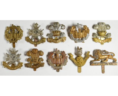Ten British Army Infantry regiment cap badges including Essex Regiment, Derbyshire Regiment and Welch Regiment