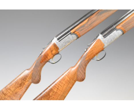 A pair of Rizzini Round Body 12 bore over and under ejector shotguns each with finely engraved locks, underside, trigger guar